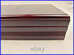 A wooden humidor is a box designed to store cigars at a minimum level of humidit